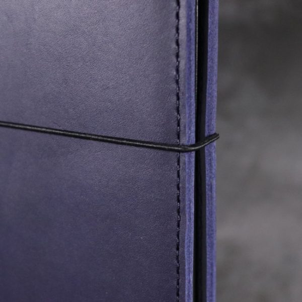 leather notebook cover elastic navy closeup