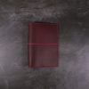 Pocket red and fuchsia leather notebook closed elastic