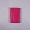 Pocket size fuchsia pink leather journal with fuchsia elastic closure