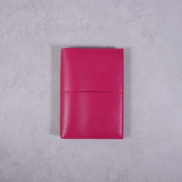 Pocket size fuchsia pink leather journal with fuchsia elastic closure
