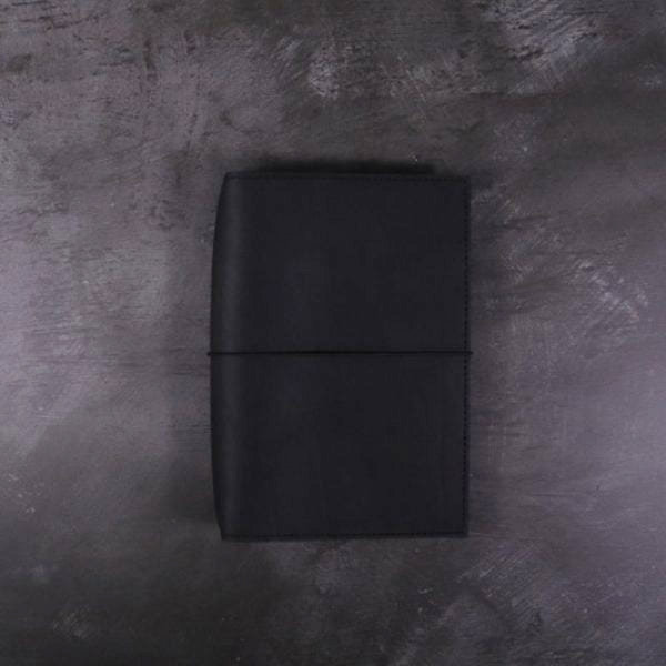 A6 black leather journal with elastic closure