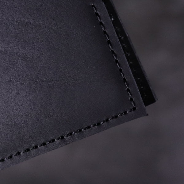 black leather notebook cover hand stitch detail