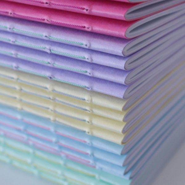 coloured notebook stack helen mclean 3