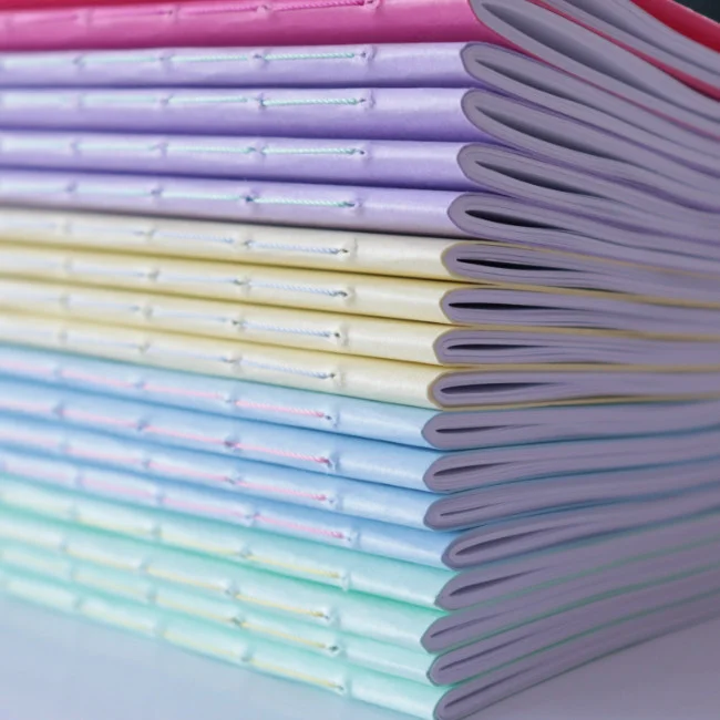 coloured notebook stack helen mclean 4
