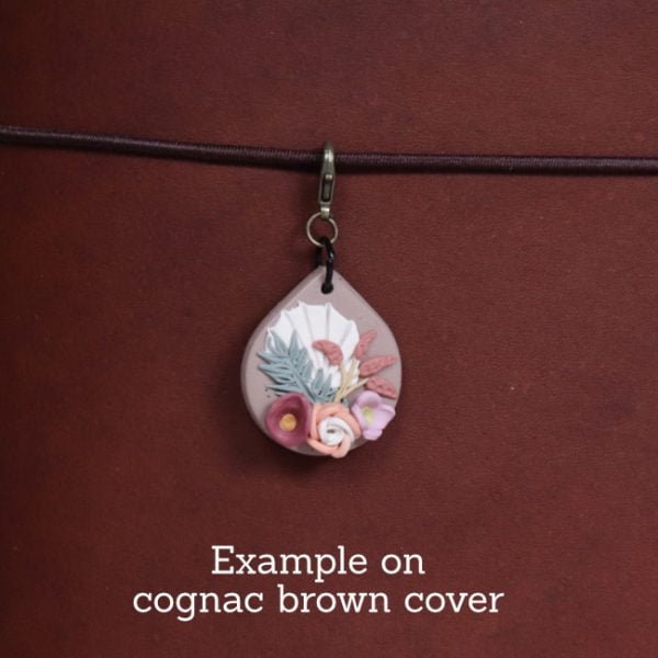 nature journal charm - wheat - example on cognac close
