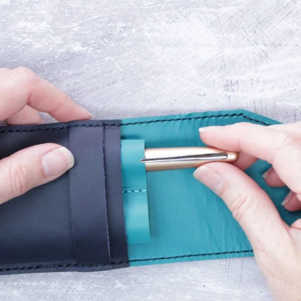 double pen case navy teal and teal leather insitu