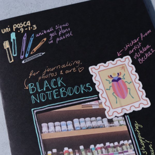 Black paper notebook - posca and uniball gel pen example